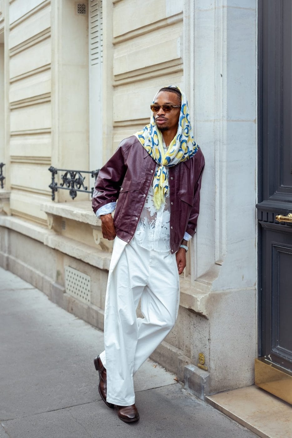 Man in a burgundy jacket and wide white trousers, Dorian Thomsson Robinson (@doriantr)