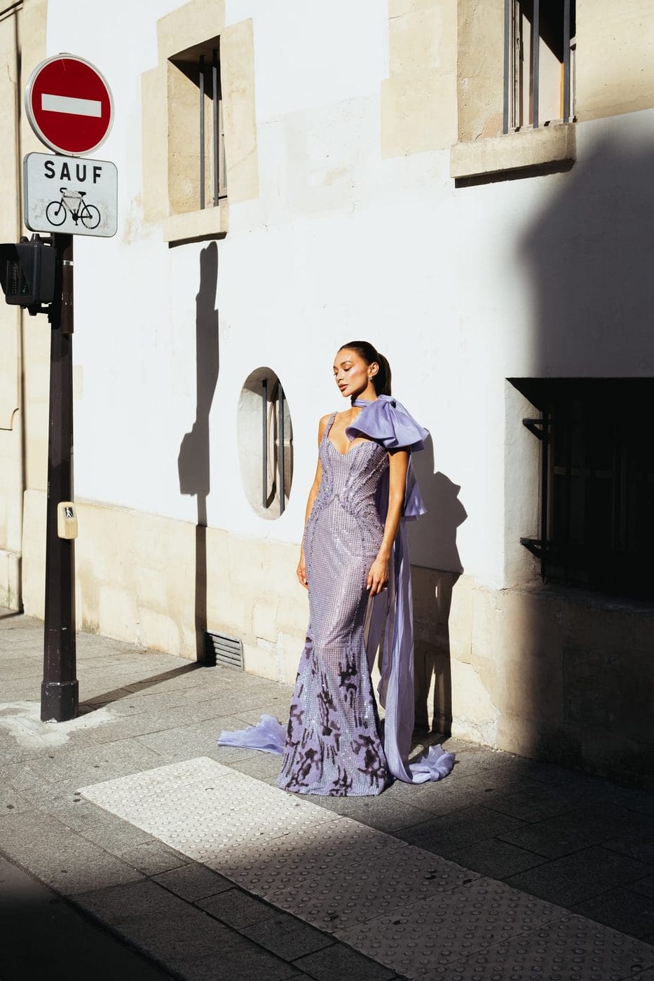 Woman in a long lilac gown on the pavement beside a no-entry sign, Kylie Verzosa (@kylieverzosa), Tony Ward Couture